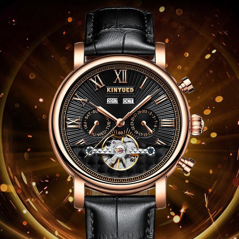 Reloj de pulsera KINYUED con diseño clásico en negro y oro rosa, correa de cuero negra y detalles de calendario y mecanismo visible.