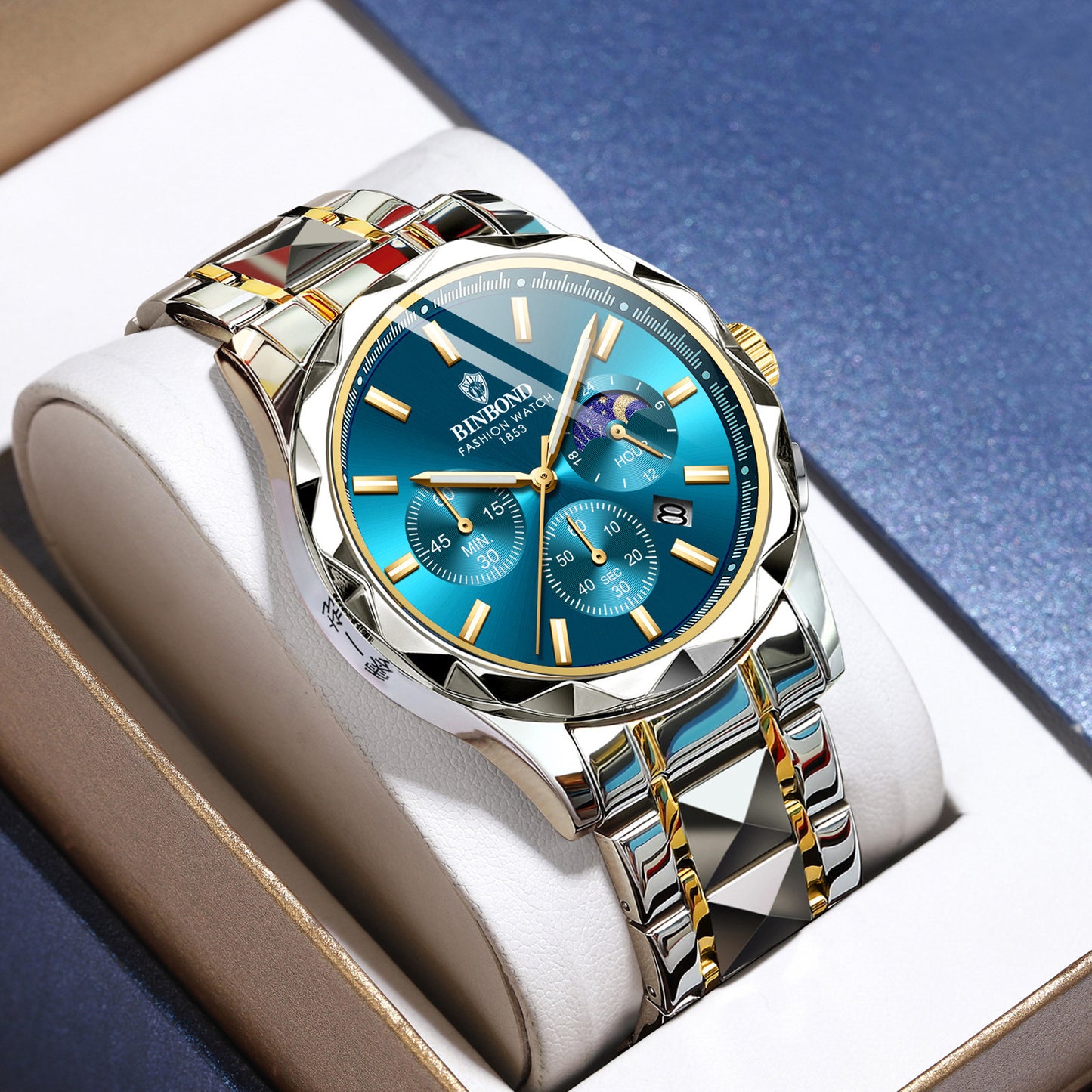 Reloj BINBOND de acero inoxidable en azul con cronómetro, detalles dorados y complicaciones de fases lunares.