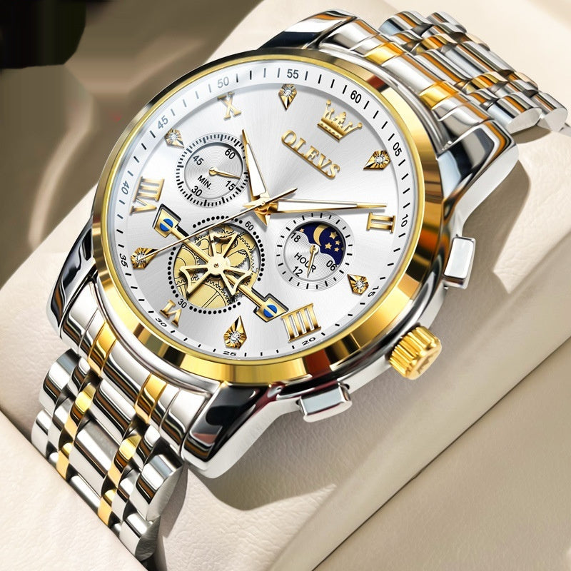 Reloj masculino Olevs con esfera blanca, detalles dorados y múltiples funciones como cronógrafo y fases lunares. Correa metálica en tonos dorado y plateado.